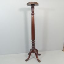An antique mahogany torchere stand. 35x165cm.
