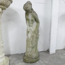 A weathered concrete garden statue, study of a classical lady. Height 79cm.