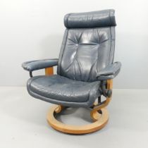 An Ekornes style stressless reclining swivel lounge chair, upholstered in blue leather. Good but