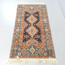 A red-ground Quashqai rug. 157x86cm.