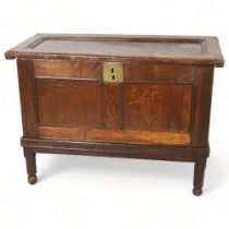 An early 18th century oak coffer on stand, height 70cm, top 98 x 45cm Cracks to base of interior,