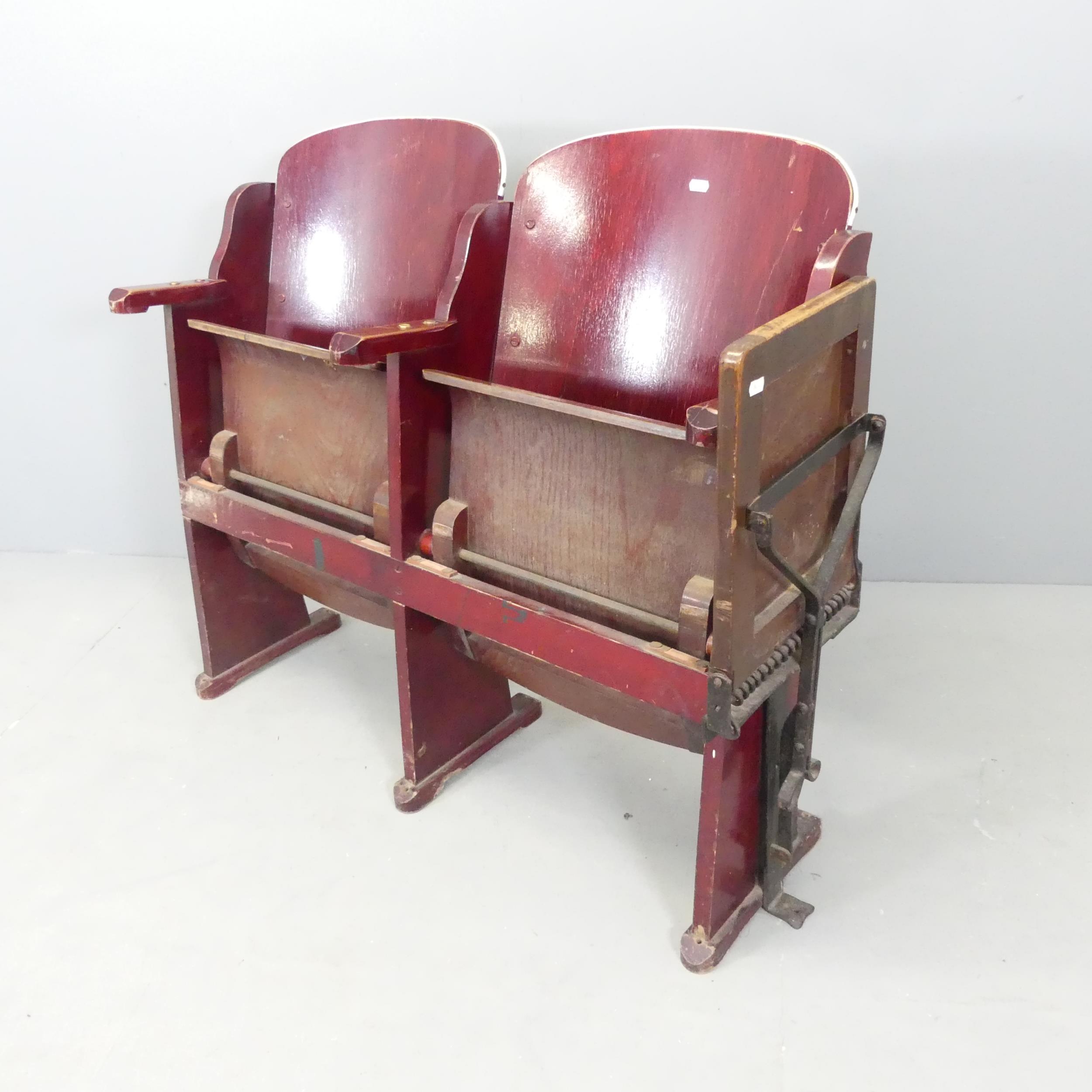 Two vintage folding cinema seats, with bent ply seats and backs. Overall (tray folded)