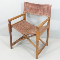 A Scandinavian design teak folding director's chair with woven seat.