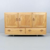 ERCOL - A mid-century Windsor model 468 sideboard, with three cupboard doors and drawers under.