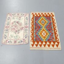 A Chobi Kilim mat, 96x63cm, and a Kashmiri hand chain stitch wall hanging, 82x56cm.