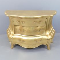 A contemporary gilt-painted baroque commode chest of three drawers in the manner of Casa Padrino.