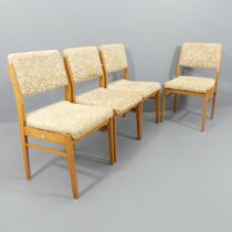 A set of four mid-century teak and upholstered dining chairs with drop in seats, Impressed GDR.