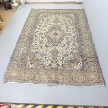 A cream-ground Kashan carpet. 295x190cm. Good condition. No signs of damage or repairs.