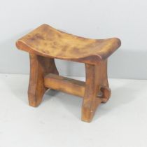 An Arts & Crafts teak stool by R B Richards & Sons, Castle Foregate Saw Mills, Shrewsbury, with