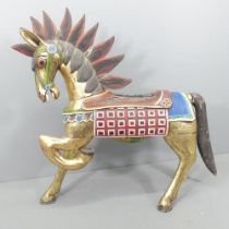 An Indonesian hand painted and gilded wooden horse. 137x132x44cm. Some repairs, particularly to mane