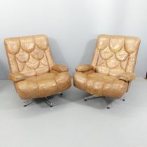 TETRAD - a pair of 1970s Nucleus swivel lounge chairs, upholstered in brown leather and raised on