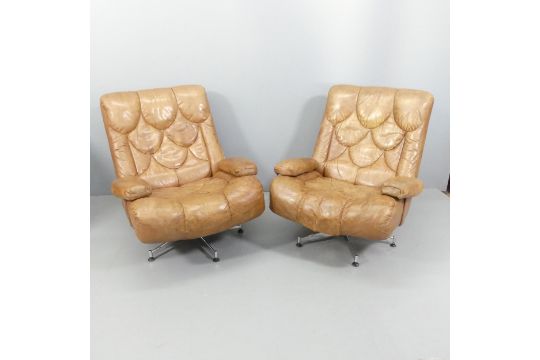 TETRAD - a pair of 1970s Nucleus swivel lounge chairs, upholstered in brown leather and raised on - Image 1 of 2