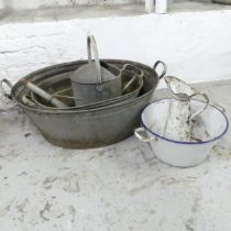 Two galvanised wash basins, a watering can, and an enamelled wash bowl and jug (5). Largest