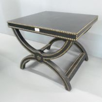 BAKER, USA - A studded black leather upholstered Alexandre x-framed stool. 61x51x56cm. Good