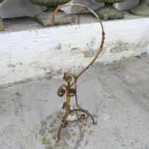 An antique painted wrought iron plant holder. Height 83cm.