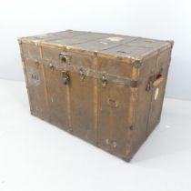 An antique leather covered and brass mounted trunk, labelled ER to side. 103x71x58cm