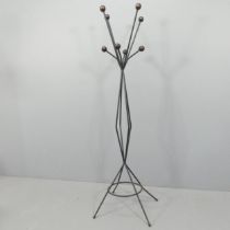 A mid-century atomic hat and coat stand in the manner of Roger Feraud, with wooden ball ends on