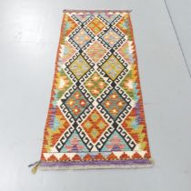 A Chobi Kilim runner. 150x66cm.