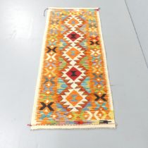 A Chobi Kilim runner. 155x66cm.