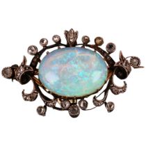 An Art Nouveau opal and diamond openwork pendant/brooch, circa 1905, centrally claw set with 4.