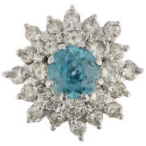 An 18ct white gold blue zircon and diamond snowflake cluster ring, maker BJ, London 1975, claw set