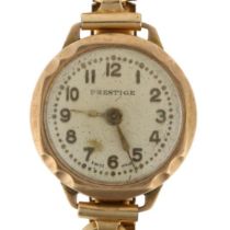 PRESTIGE - a lady's 9ct gold mechanical wristwatch, silvered dial with applied gilt Arabic numerals,