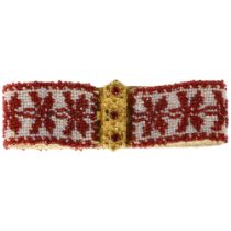 A Georgian garnet and glass beaded cuff bracelet, circa 1800, the gilt-metal floral clasp suspending