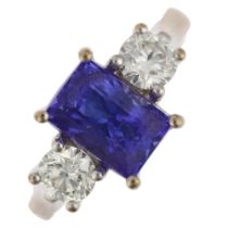 An 18ct white gold three stone tanzanite and diamond ring, maker AFJ, London 2016, centrally claw
