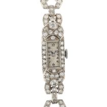 A lady's Art Deco platinum and diamond cocktail mechanical wristwatch, circa 1930s, silvered dial