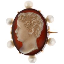 A 19th century sardonyx and pearl cameo brooch, relief carved depicting male profile, frame