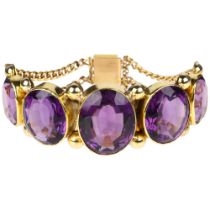 A large Victorian graduated five stone amethyst bracelet, circa 1860, rub-over set with oval mixed-