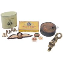 A collection of various items, including a music box, Dill's Best Cigarette tin, RAF Wings, a