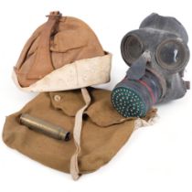 An RAF leather cap by Adastra, and a gas mask in canvas case