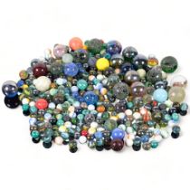 A tin of Vintage marbles, including alleys