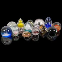 A collection of 14 glass paperweights, including Caithness, and a plastic insect paperweight,