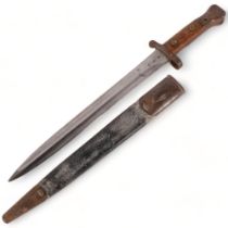 An 1888 British Lee Metford bayonet and scabbard, blade length 32cm, overall length 42cm