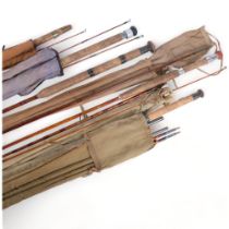 A selection of early 20th century split cane and other associated freshwater fishing rods, including