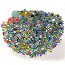 A large boxful of glass marbles