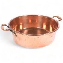 A large Victorian polished copper 2-handled jam pan