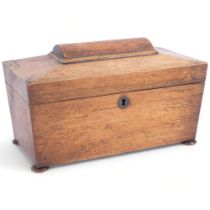 A Regency rosewood tea caddy of sarcophagus form, with fitted inner lids and mixing bowl, and silver