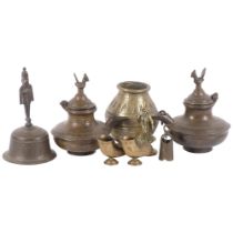 A group of Eastern brass items, including a bell, 16cm, 2 lidded jugs with cockerel finials, etc