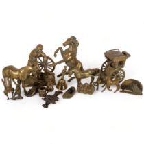 A collection of solid brass figures, including several horses, a group of 3 Hear No Evil, See No