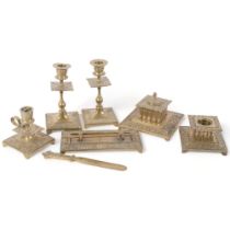 An 8-piece Antique embossed brass desk set, including a pair of candlesticks, 16.5cm, 2 inkwells,