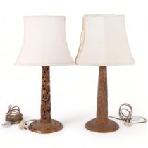 2 ornately carved wood table lamps on circular plinths, with shades, height overall 62cm