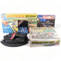 Matchbox Motorway M2, Escape from Colditz game, a Scalextric 200, and track