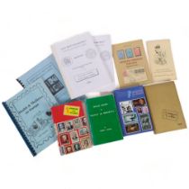 A collection of hard and softback books illustrating a list of postage stamps from around the world,