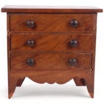 A 19th century mahogany apprentice piece table-top chest of 3 drawers, with turned wood handles,