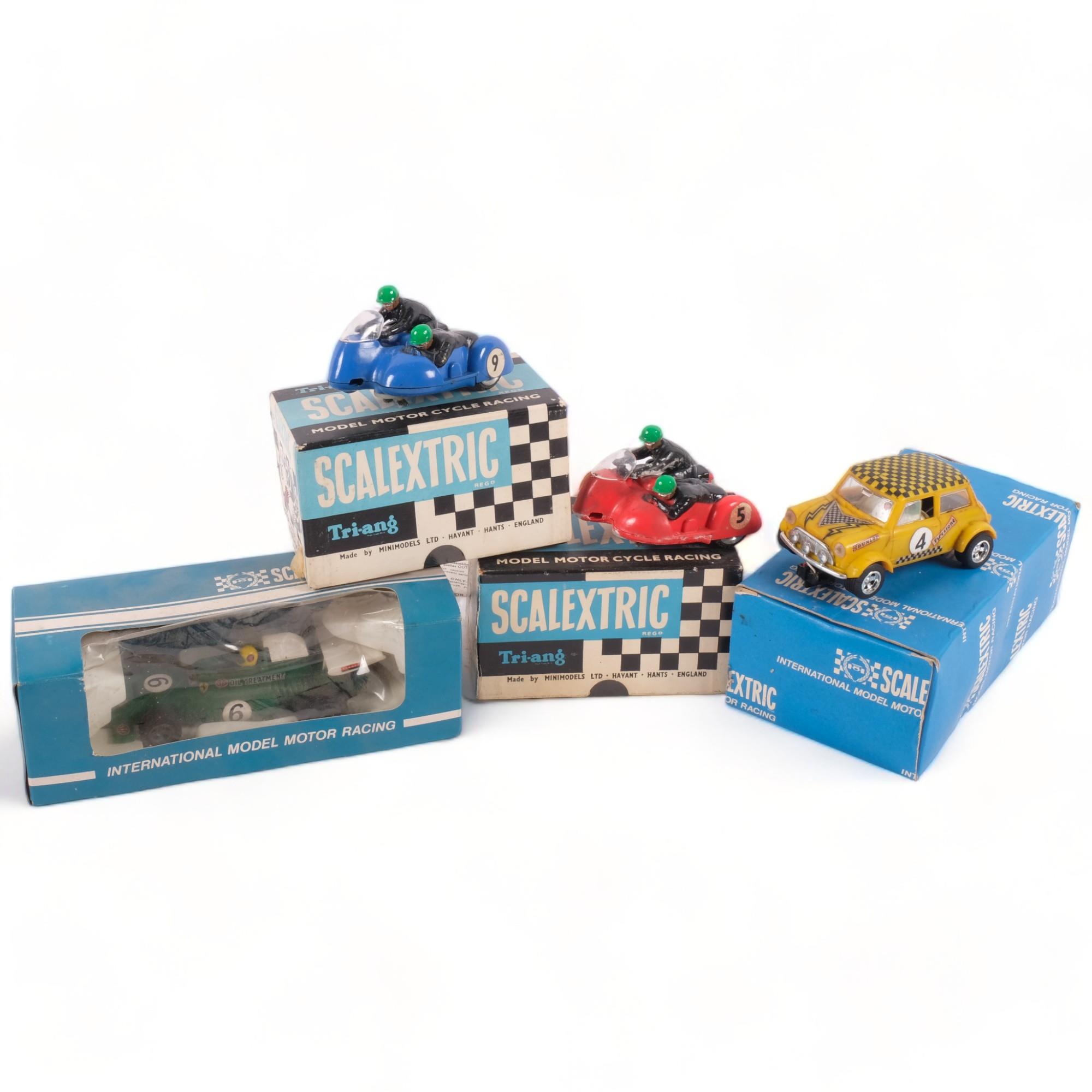 2 boxed Tri-ang Scalextric motor cycle racing typhoons, a Mini, and a boxed BRM