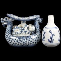 A Chinese porcelain blue pillow with 6 character mark, and an Oriental blue and white vase, 15cm