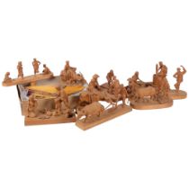 A collection of carved wood figures, various activities including riding a buffalo, and woodworking,